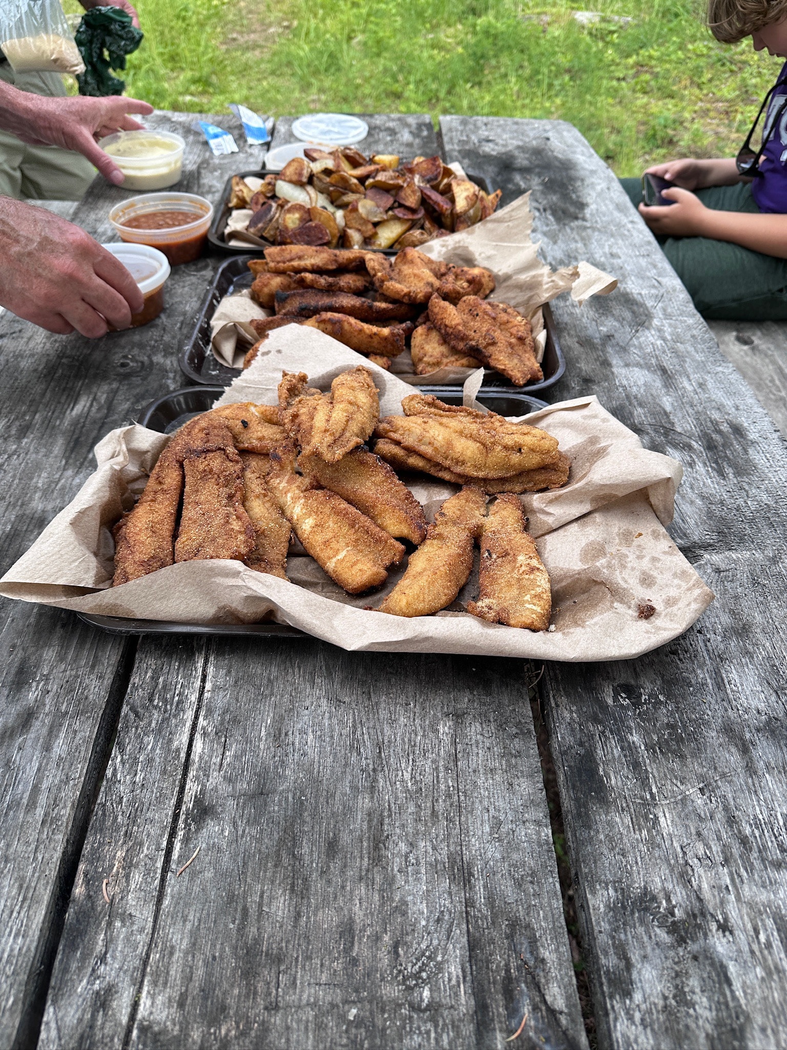 Fried fish and potatoes at shore lunch