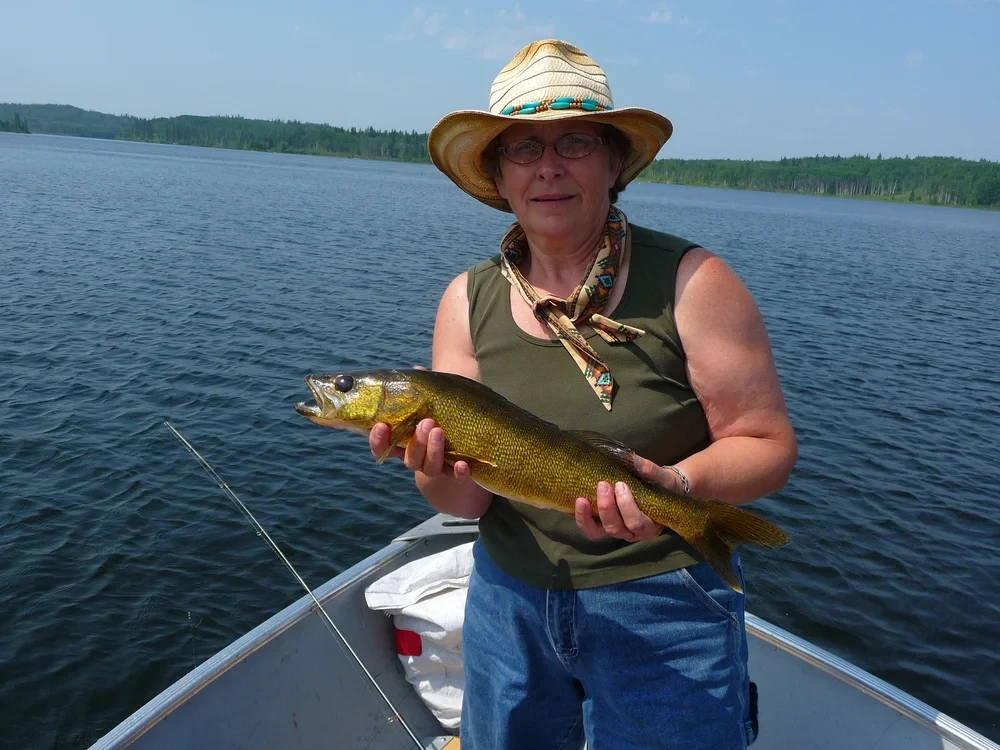 Angler with a trophy catch on the Churchill River System
