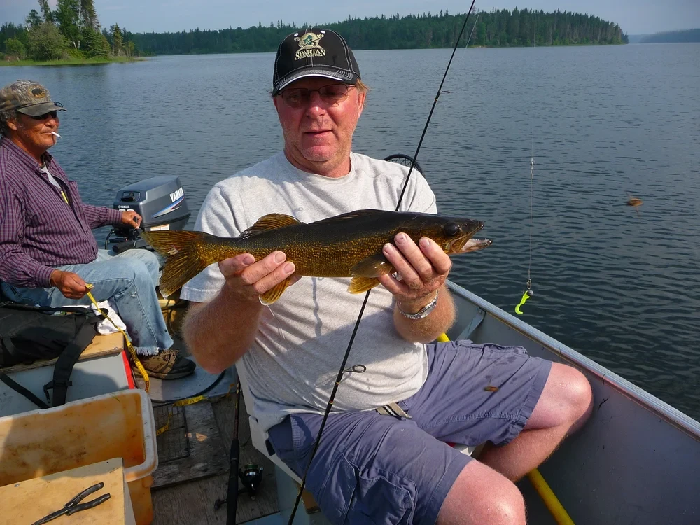 Angler holding a trophy Northern Pike at Black Bear Island Lodge