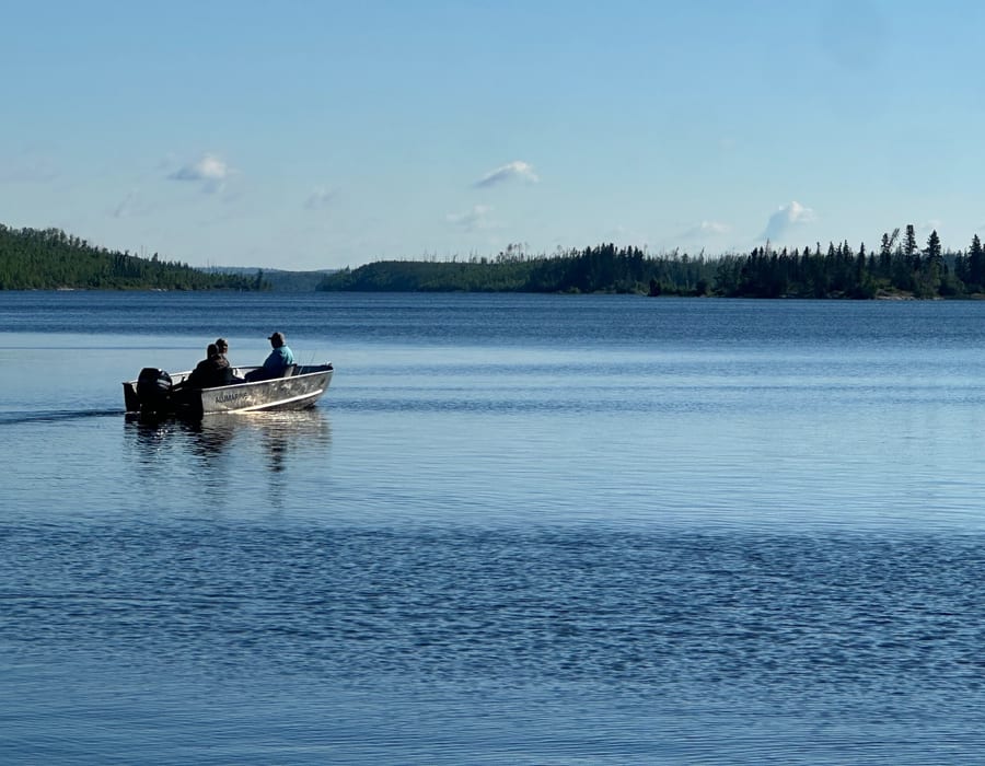 Angler holding trophy northern pike on a remote Saskatchewan lake